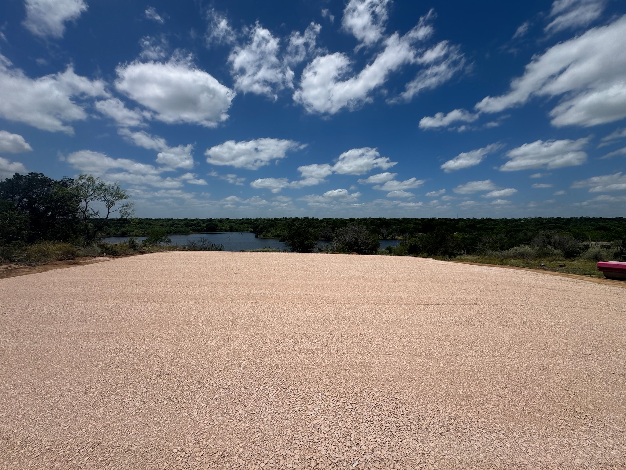 Sandy clearing overlooking wetland landscape